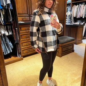 Black & white plaid fuzzy pull over w/ side faux leather zippers on both sides.